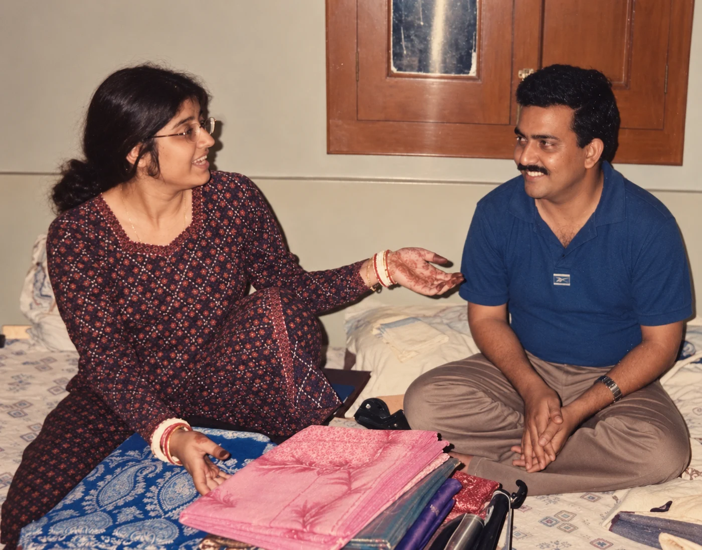 A candid early photograph of the couple smiling at each other
